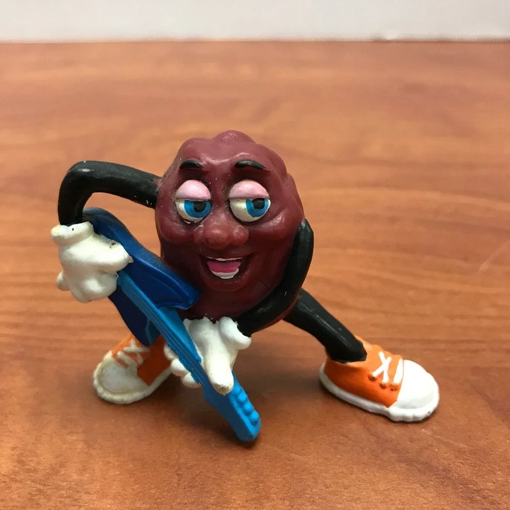4 Vintage California Raisins figurines - Guitar - Skateboard - Surfer - Trumpet